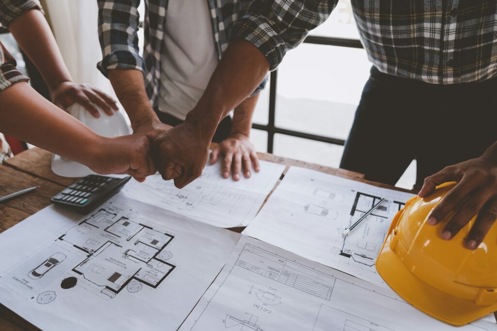 A team of and engineers have joined hands on with building a successful project teamwork concept.