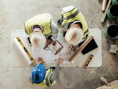 Architect, engineer and teamwork with blueprint from above on a building or contractor project. Bui